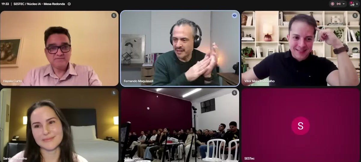 Still from the I SESTEC 2026 roundtable livestream 'AI and the Future of Competencies' hosted by Núcleo de IA & GP — a six-tile video-call grid of the panelists, with Sarah Rodovalho at lower left, fellow panelists joining remotely, and the in-person student audience in Brazil